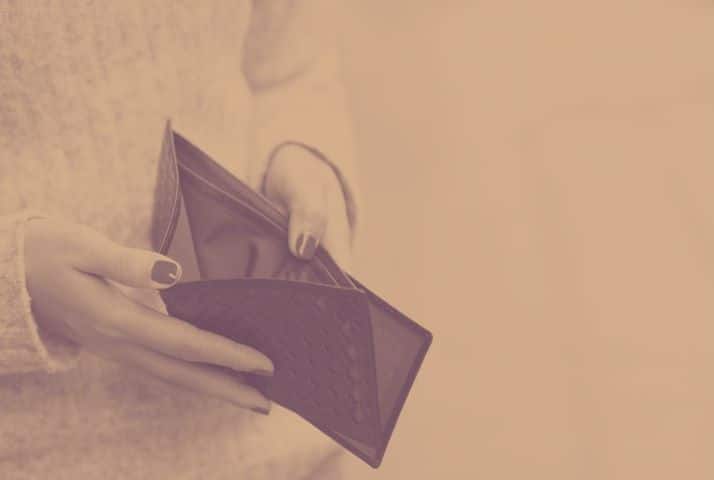 Lady hands holding an open empty wallet. 